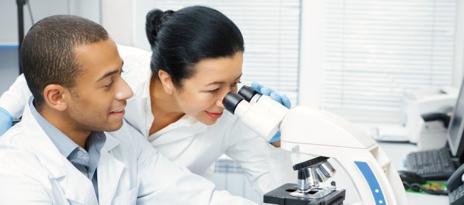 medical staff looking at the microscope