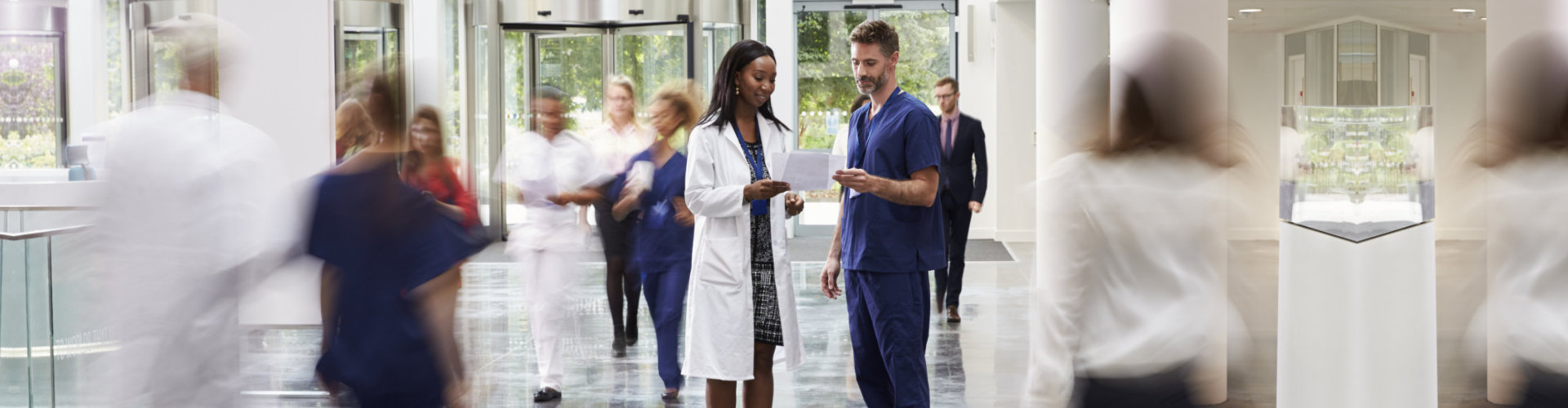 medical staff talking looking at the paper