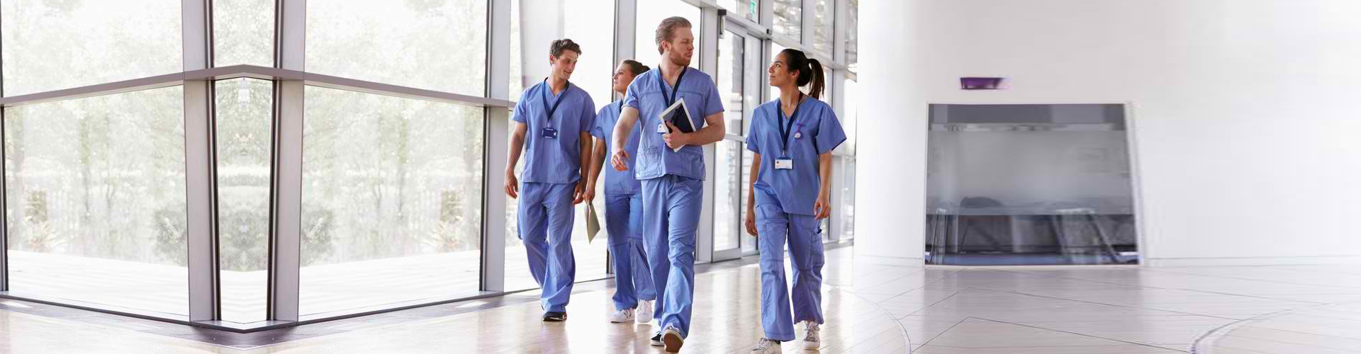 a group of nurses walking